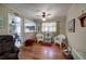 Open living space with hardwood floors, open to kitchen, and vintage furnishings at 1122 Byers Sw Dr, Marietta, GA 30060
