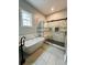Spa-like bathroom with a freestanding tub, frameless shower, and elegant tile accents at 135 Yancey Rd, Covington, GA 30014