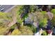 Aerial view of a home with a backyard and mature trees, close to the highway at 1911 Woodland Hills Nw Ave, Atlanta, GA 30318
