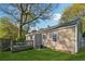 Backyard featuring a well-maintained lawn, mature trees, and fenced in for added privacy at 1911 Woodland Hills Nw Ave, Atlanta, GA 30318