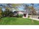 Charming single-story home with a well-manicured lawn and a welcoming red front door at 1911 Woodland Hills Nw Ave, Atlanta, GA 30318