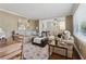 Comfortable living room with hardwood floors, a neutral color palette, sofas, and adjoined dining space at 1911 Woodland Hills Nw Ave, Atlanta, GA 30318