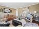 Comfortable living room area featuring a plush sofa, decorative pillows, and a dining table at 1911 Woodland Hills Nw Ave, Atlanta, GA 30318