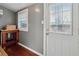 Functional mudroom with wooden accents, a side entrance, and bright natural light filtering through the windows at 1911 Woodland Hills Nw Ave, Atlanta, GA 30318