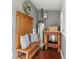 Cozy mudroom with a wooden bench, coat rack, and storage, providing a functional and welcoming transition space at 1911 Woodland Hills Nw Ave, Atlanta, GA 30318