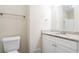 A bathroom with a toilet, granite countertop, and a vanity with white cabinets at 3841 Greenbrook Dr, Douglasville, GA 30135