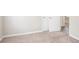 This carpeted bedroom includes two closets with white doors and an open doorway to another room at 3841 Greenbrook Dr, Douglasville, GA 30135