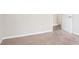 The bedroom features a carpeted floor and a view into another room through an open white door at 3841 Greenbrook Dr, Douglasville, GA 30135