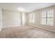 Neutral bedroom with carpet, built-in shelving and window at 3841 Greenbrook Dr, Douglasville, GA 30135