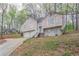 Charming two-story home with a two-car garage and a stairway to the entrance at 3841 Greenbrook Dr, Douglasville, GA 30135