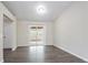 Bright living room featuring modern flooring and a sliding door to the outside at 3841 Greenbrook Dr, Douglasville, GA 30135