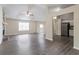 Bright, open-concept living room with modern flooring adjacent to the kitchen at 3841 Greenbrook Dr, Douglasville, GA 30135
