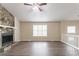 Spacious living room featuring a stone fireplace and modern flooring at 3841 Greenbrook Dr, Douglasville, GA 30135