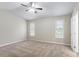 Large main bedroom with carpet, windows with blinds, a ceiling fan, and white paint at 3841 Greenbrook Dr, Douglasville, GA 30135