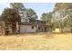 This backyard features a beautiful pergola, painted brick, sunroom and straw ground cover at 1749 Lauranceae Way, Riverdale, GA 30296