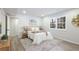 Neutral primary bedroom with window and hardwood flooring at 1749 Lauranceae Way, Riverdale, GA 30296