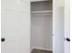 Open closet providing ample storage space with shelving and clothing rod at 1749 Lauranceae Way, Riverdale, GA 30296
