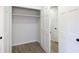 Walk-in closet with white trim and shelves at 1749 Lauranceae Way, Riverdale, GA 30296