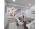 Elegant dining area with modern table set and staircase access to the second floor at 1749 Lauranceae Way, Riverdale, GA 30296