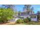Charming white brick home with black shutters and well-maintained landscaping at 1749 Lauranceae Way, Riverdale, GA 30296