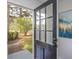 Inviting front door with glass panels offering a view of the landscaped front yard at 1749 Lauranceae Way, Riverdale, GA 30296