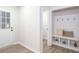 Hallway with entryway coat rack and bench seat at 1749 Lauranceae Way, Riverdale, GA 30296