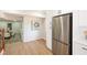 Stainless steel refrigerator and hardwood floors in the kitchen area at 1749 Lauranceae Way, Riverdale, GA 30296