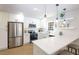 Modern kitchen with white cabinetry, stainless steel appliances, and breakfast bar at 1749 Lauranceae Way, Riverdale, GA 30296