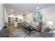 Bright and airy living room with modern decor, stainless appliances, and ample seating at 1749 Lauranceae Way, Riverdale, GA 30296