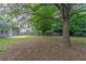 Home with spacious backyard offering privacy with mature tree coverage at 223 Gilliam Ct, Locust Grove, GA 30248