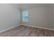 Cozy bedroom featuring light grey walls and a window with natural light at 223 Gilliam Ct, Locust Grove, GA 30248