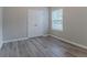 Comfortable bedroom featuring double doors and window at 223 Gilliam Ct, Locust Grove, GA 30248
