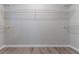 Walk-in closet featuring custom shelving for optimal organization and storage at 223 Gilliam Ct, Locust Grove, GA 30248