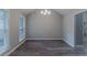 Dining room with abundant natural light and modern chandelier at 223 Gilliam Ct, Locust Grove, GA 30248