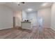 Bright, open-concept living area with high ceilings and modern flooring at 223 Gilliam Ct, Locust Grove, GA 30248