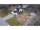 An aerial view of a single-story home with a long driveway and a traditional, well-maintained lawn at 2326 Noahs Ark Rd, Jonesboro, GA 30236