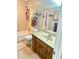 Bathroom featuring a combination tub and shower, a cream color tiled wall, and neutral flooring at 2326 Noahs Ark Rd, Jonesboro, GA 30236