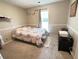 Guest bedroom with a decorative bed and a large window with natural light at 2326 Noahs Ark Rd, Jonesboro, GA 30236