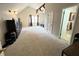 Spacious primary bedroom featuring vaulted ceilings, carpet flooring, and a ceiling fan at 2326 Noahs Ark Rd, Jonesboro, GA 30236