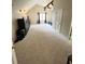 Large main bedroom with vaulted ceilings, carpet flooring, and a ceiling fan at 2326 Noahs Ark Rd, Jonesboro, GA 30236