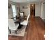 Formal dining room featuring a marble table and hardwood flooring at 2326 Noahs Ark Rd, Jonesboro, GA 30236