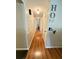 Inviting hallway with hardwood floors, leading to the rest of this charming home at 2326 Noahs Ark Rd, Jonesboro, GA 30236