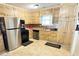 Traditional kitchen features stainless appliances, ample cabinet storage, and neutral countertops at 2326 Noahs Ark Rd, Jonesboro, GA 30236