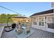 Cozy back deck with outdoor seating and an umbrella; perfect for relaxing outdoors at 2810 Burgundy Dr, Cumming, GA 30041