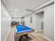 Finished basement featuring a pool table, living area, and natural lighting great for entertaining guests at 2810 Burgundy Dr, Cumming, GA 30041