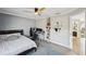 Bedroom featuring a ceiling fan, and a view of the hallway at 2810 Burgundy Dr, Cumming, GA 30041