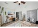 Bedroom featuring light walls, a ceiling fan, closet, and a view of the hallway at 2810 Burgundy Dr, Cumming, GA 30041