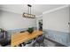 The dining room offers modern lighting and wainscoting at 2810 Burgundy Dr, Cumming, GA 30041