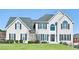 Beautiful home with a manicured lawn, symmetrical windows, and a welcoming front entrance at 2810 Burgundy Dr, Cumming, GA 30041