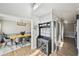 Hallway view featuring a dining room, built-in coat rack and storage, and hardwood flooring at 2810 Burgundy Dr, Cumming, GA 30041